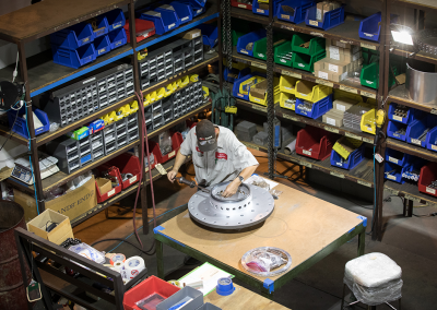 Victor Enterprises | Precision Machine Shop | Team Member working on a prototype