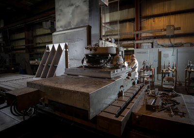 Victor Enterprises | Precision Machine Shop | Staff Member Working with Machinery